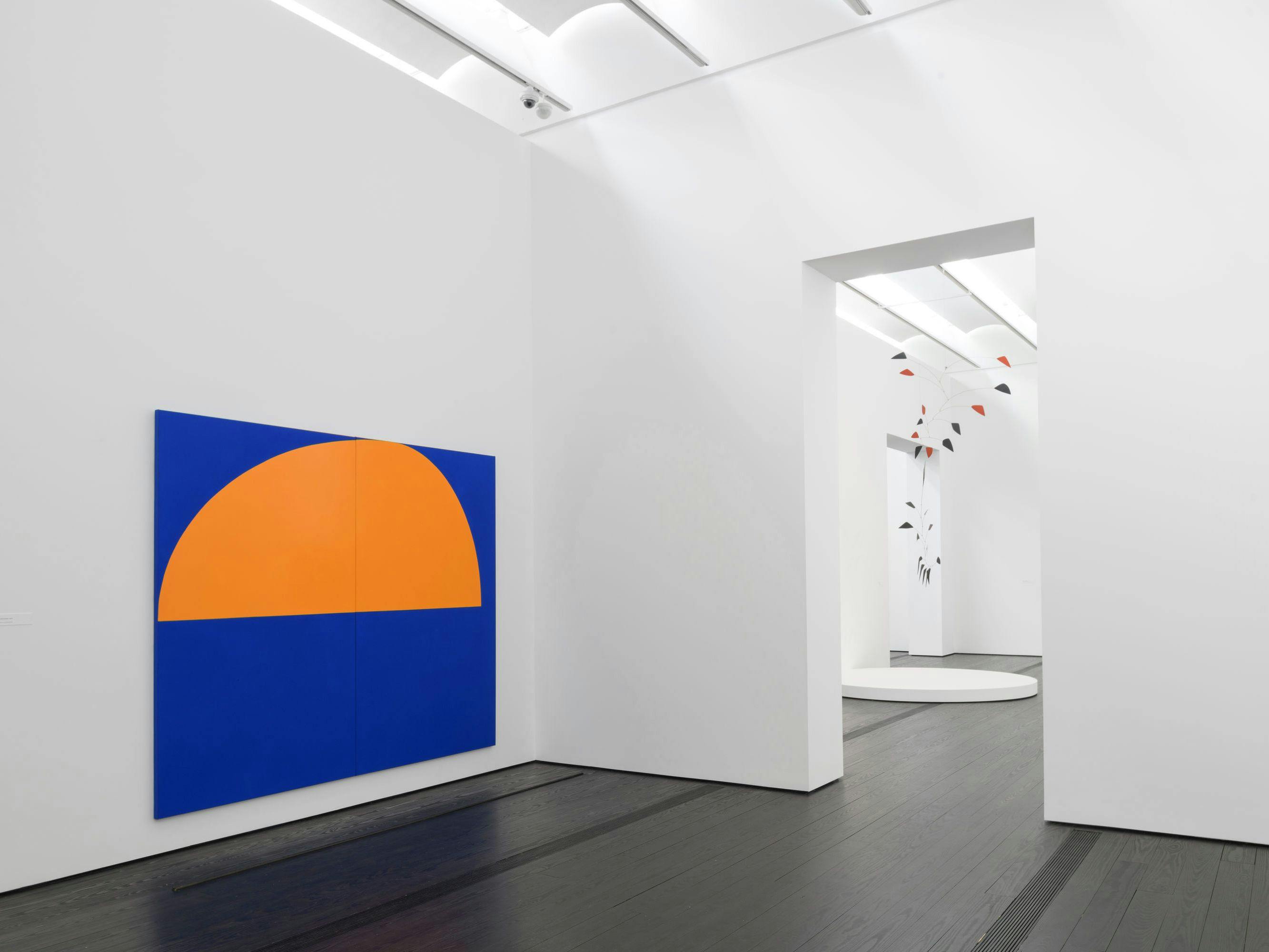 Installation view of Suzan Frecon’s orange and bluebird blue illumination, 2019 at Menil Collection, 2021.